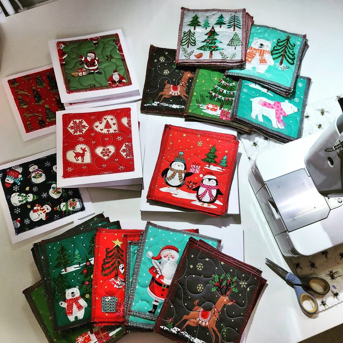 NadiaRosemakes's tweet photo. Christmas card making today, these are selling out before I can get them on the website 🙂🎄🎅🏻. DM me if you'd like to order some.  These cards have quilted cotton patches that have a neat overlocked edge and have been sewn onto the card. https://t.co/DJRdqbqjP7