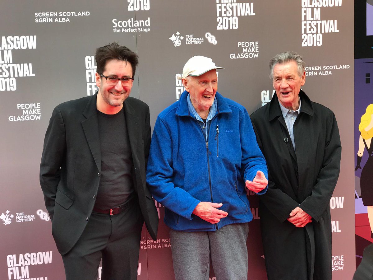 CosmicCatFilm's tweet photo. We are saddened to learn of the passing of Hamish MacInnes, guardian angel to mountaineers around the globe and true hero of our time. He lived a great life and saved countless more. Here he is meeting some fans @glasgowfilmfest last year. Rest in peace, Hamish. https://t.co/zHxIWet0lD