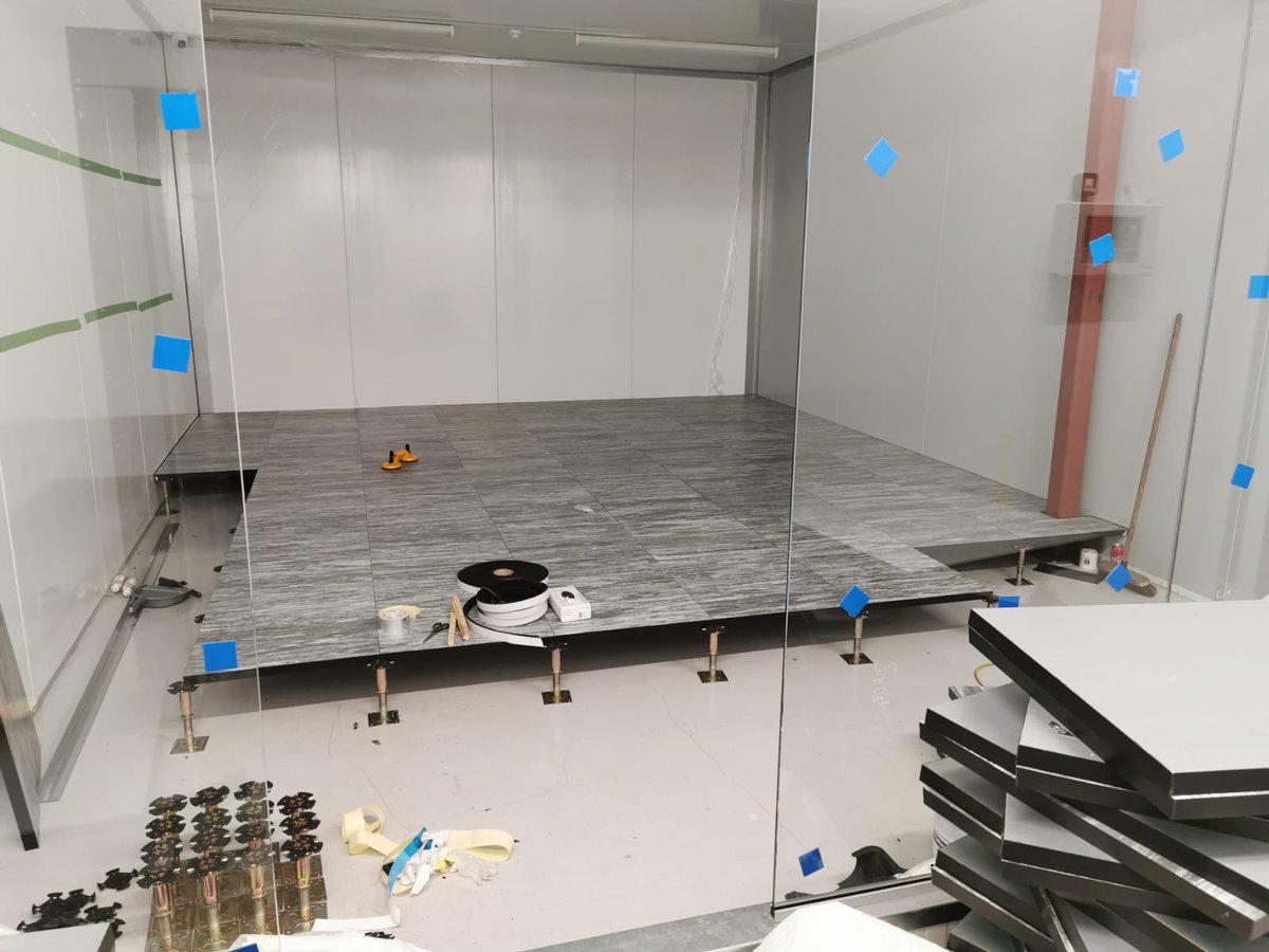 SafehostsDC's tweet photo. We love a good raised floor, and not just for server rooms. We're laying this raised access flooring in our new NOC to ensure all cabling is out of sight and we can easily reconfigure seating arrangements as per changing Government guidelines. #raisedflooring #safeworking https://t.co/guGiVvydId