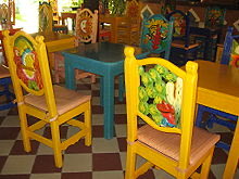 Highly decorated carved-back chairs in Mexico