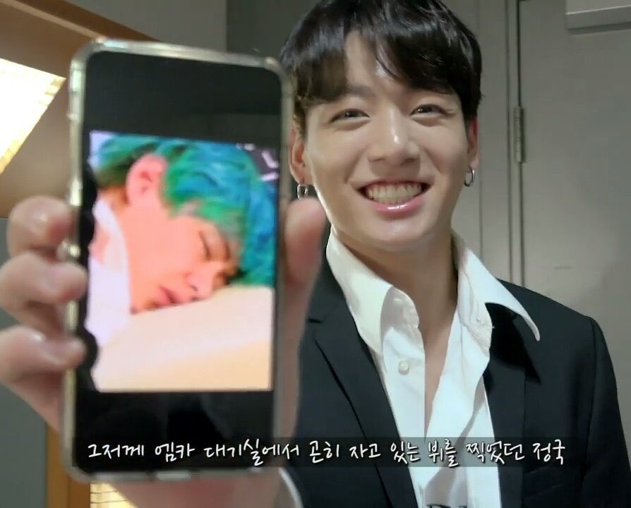 jungkook’s smile while he was showing a pic of taehyung sleeping