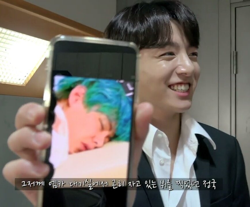 jungkook’s smile while he was showing a pic of taehyung sleeping