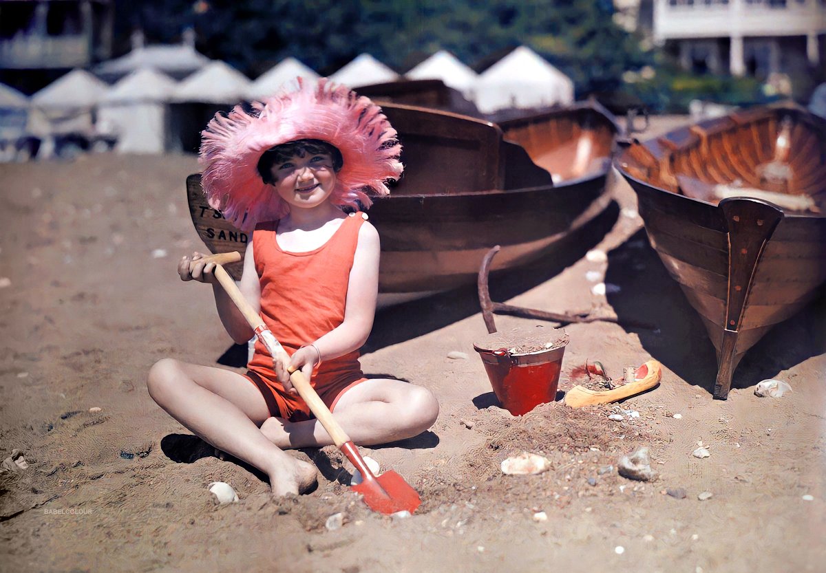StuartHumphryes's tweet photo. Let us leave this chilly November evening and travel back to the sunshine of 1928. I have Babelised this photo of the beach at Sandown on the Isle of Wight, taken in colour 92 years ago by the visiting American photographer Clifton R Adams. (It is not colourised) https://t.co/rwSzx9bJaK