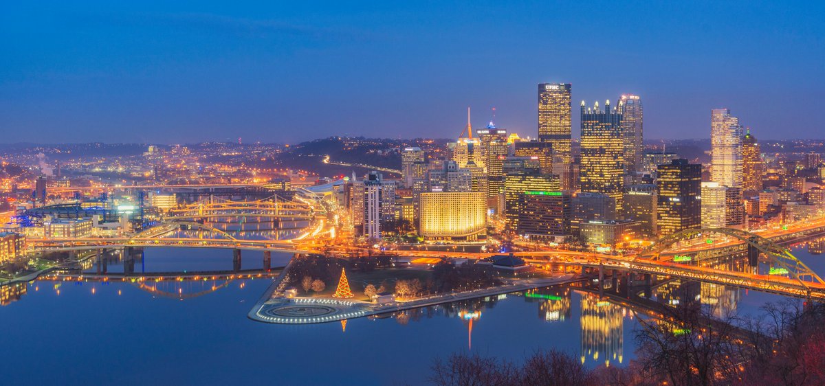 DaveDiCello's tweet photo. This is one of my favorite holiday skyline images of #Pittsburgh; the water was so calm and the warm glow of the city looked incredible against those deep blue tones of dusk. Everything was just so clear that night (December 3rd, 2013)...really made for an amazing view. https://t.co/0xbwAgxKvW