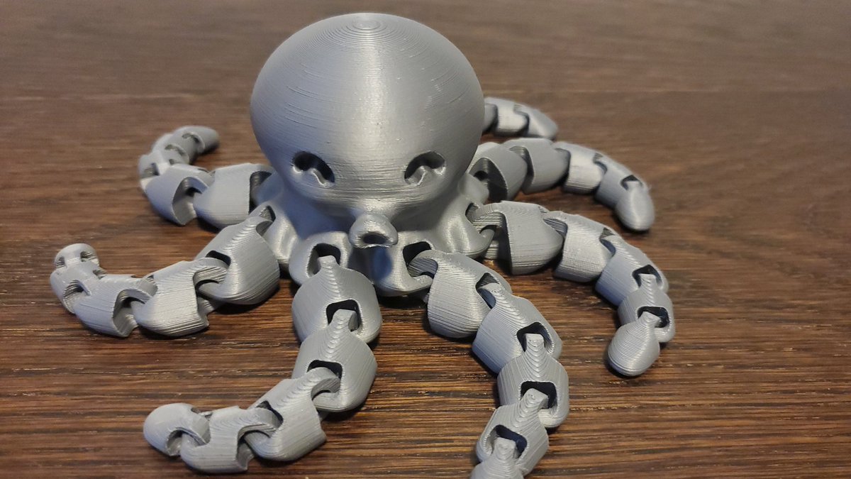 That was with no tuning and no prior experience. Then I installed Prusa Slicer and went on a rampage on Thingiverse. First I printed this octopus in one piece, magnified to 150%. My 18month old seems to like it. (PLA is non-toxic, made from plant starch.  https://en.m.wikipedia.org/wiki/Polylactic_acid)