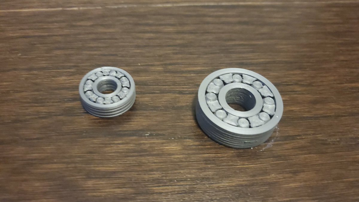 Next up, I wanted to push some boundaries. How about a 3d printed plastic ball bearing? Why not? The one on the right was magnified 2x, and printed in high detail. The one on the left, original size, works much better.  https://www.thingiverse.com/thing:4628063 