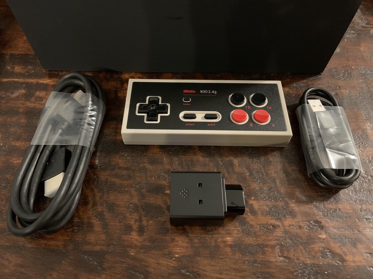 OutdateRef's tweet photo. My #analogue #ntmini #noir finally arrived today. I like the heft of this console. Seeing how the #nes & #famicom is one of my favorite consoles, I’m glad to have preordered one back in March. Now I need to set this up & see what it can do. #retro #gaming https://t.co/Rx2rwl8VsY