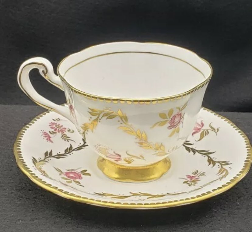 Just won this tea cup set  I really love the amount of open space between the flowers and gold. Not to mention the scalloped gold detailing is so charming!