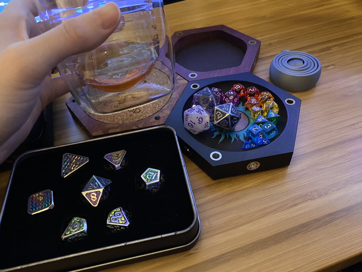 likesevenspoon's tweet photo. Getting back to #ShiftDnD ! This drink is called a c(old) fashioned by @yescocktailco , the dice are by @dieharddice and @gemhammer, table top tiles by @wyrmwoodgaming and that little fidget toy was printed by @notluthera. Wheeeee https://t.co/ZjVAH6qSZt