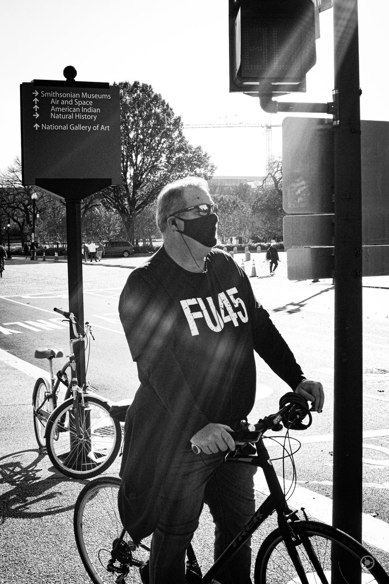 Off to one side, a man with a "FU45" shirt stood on his bike."I just wanted to go for a bike ride." he muttered.