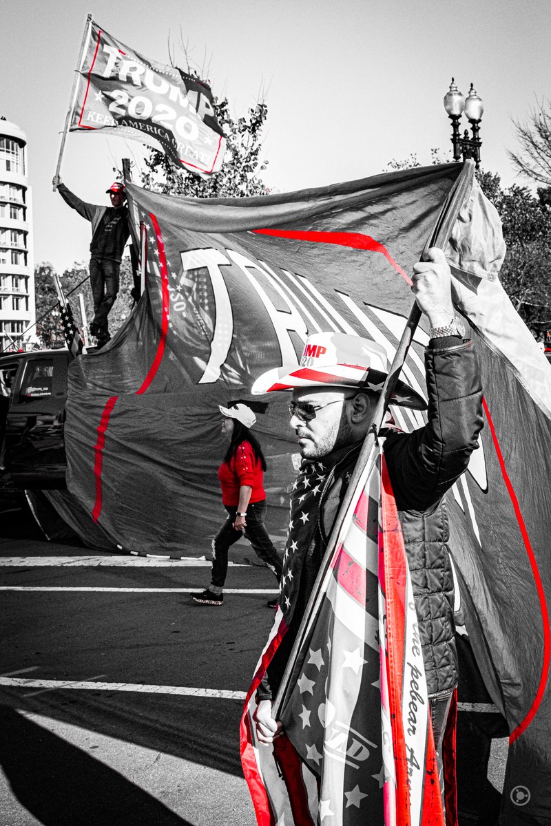 Guys standing on a truck from Georgia (which Trump lost, twice, by over 12,600 votes) stood holding an enormous Trump flag which people stood in front of to take selfies."I'm kinda tired." called out the man in the cowboy hat to the man on the truck.