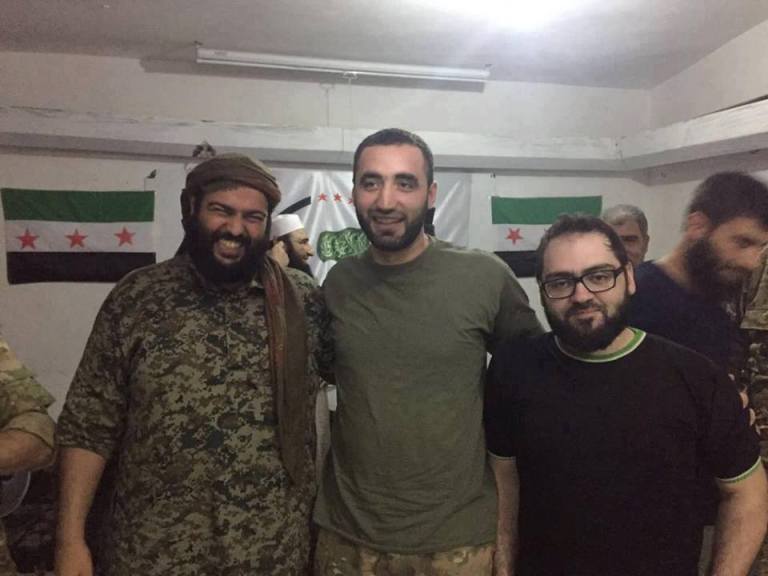 13. Another attendee at rally where Habak is hugging quite a few members of armed groups, is believed to be Ahmed Mojadidi - who welcomed Sheikh Abdullah Muhaysini to terrorist-occupied East Aleppo in 2016 - Muhaysini is Riyadh funded fanatic, trainer of child suicide bombers etc