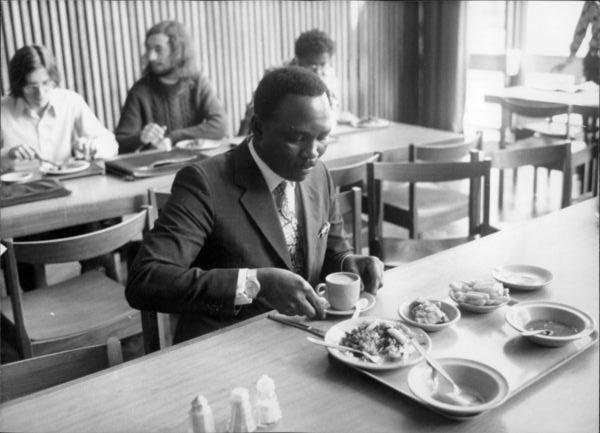 Gowon in the cafeteria of the University, and Gowon after graduating with a PhD