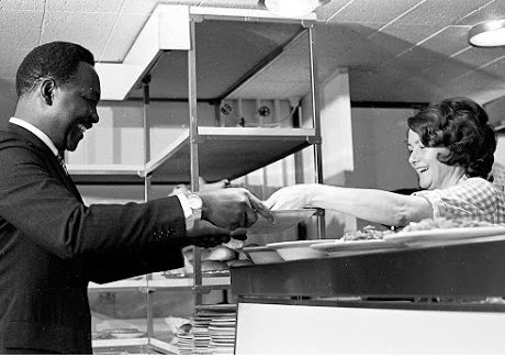 Gowon in the cafeteria of the University, and Gowon after graduating with a PhD