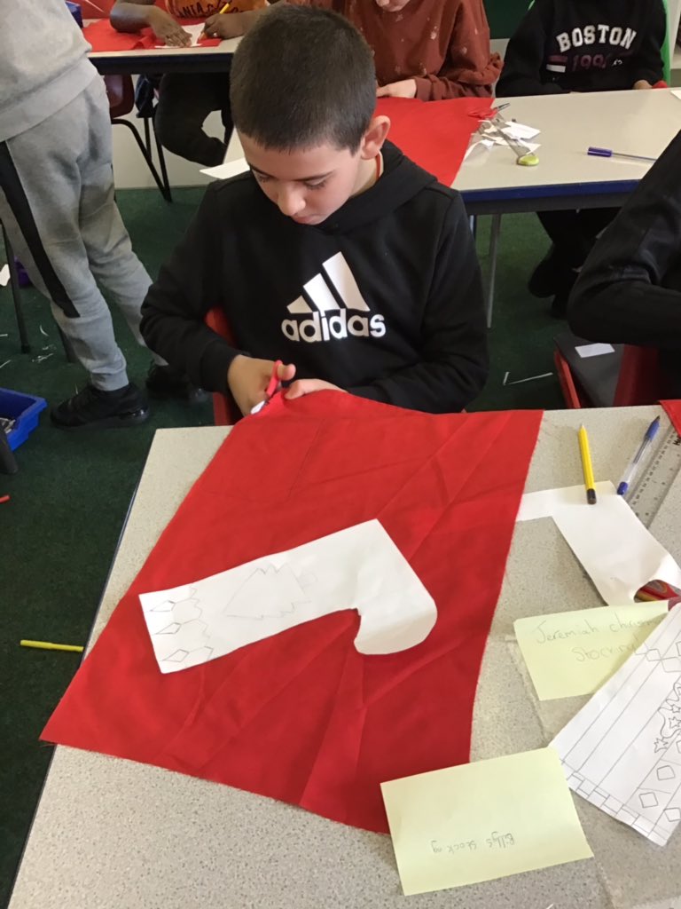 StCuthbertsPrm's tweet photo. In St Tathan, we cut our fabric to create our fantastic Christmas stockings. #sttathan @CSCJES @CSC_ExpArts https://t.co/ck3hOPxos0