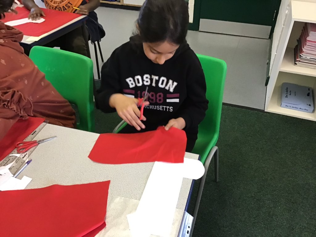 StCuthbertsPrm's tweet photo. In St Tathan, we cut our fabric to create our fantastic Christmas stockings. #sttathan @CSCJES @CSC_ExpArts https://t.co/ck3hOPxos0