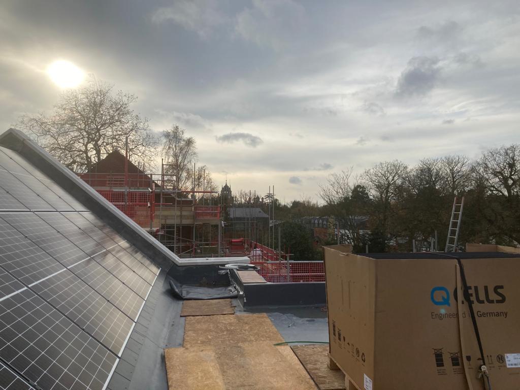 The first panels being fitted on to one of the blocks