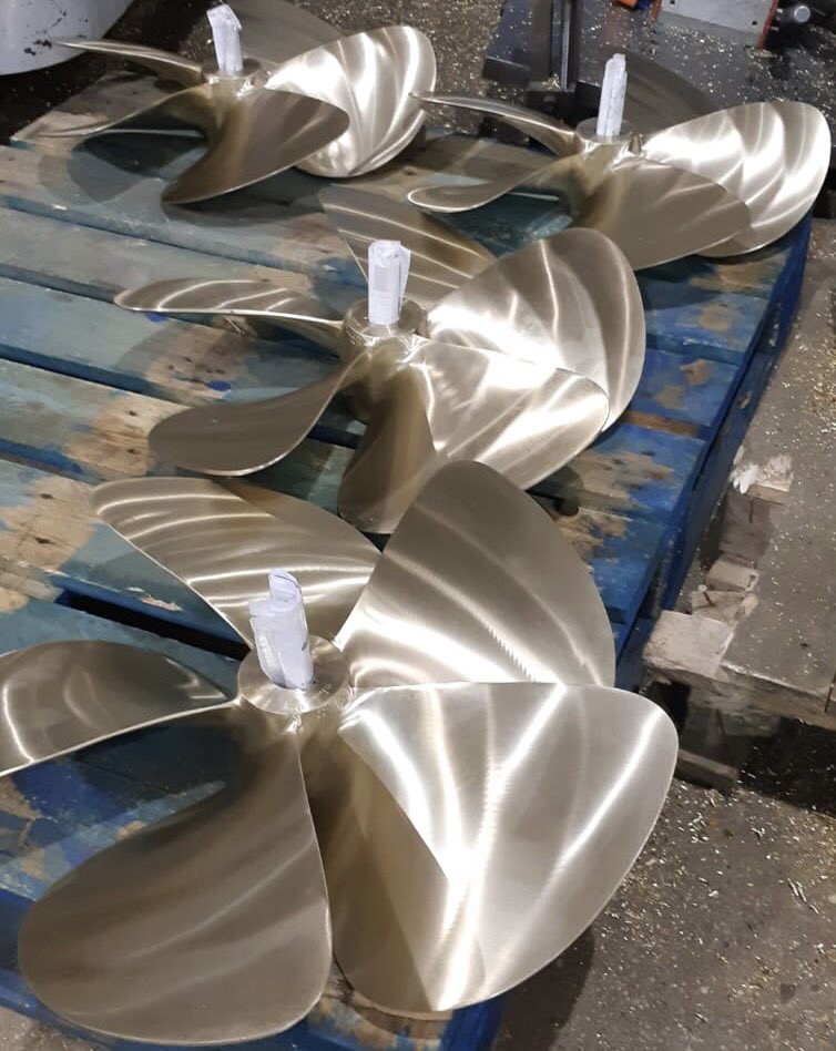 Some nice shiny new #propellers all lined up ready for shipping to a customer #boatprop #motorboat