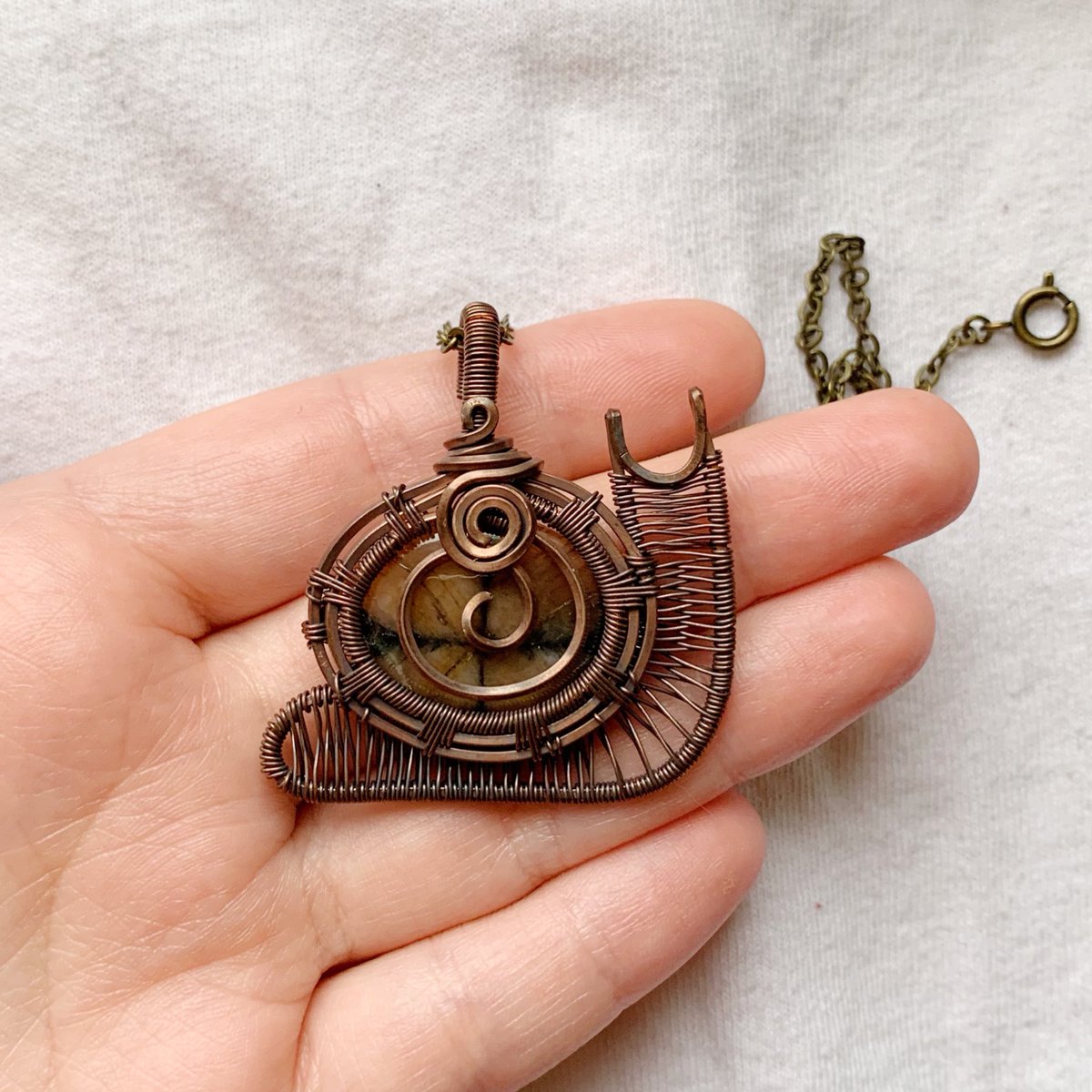 chiastolite snail pendant 🐌🌿

handmade by me :)