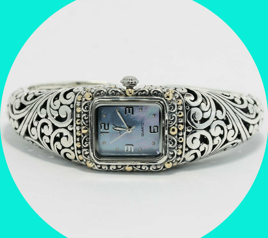 EmpirePawn's tweet photo. Elegant designer bracelet watch featuring a filigree cuff in 18K yellow gold and silver, and a mother of pearl face. (22.1 MM) Perfect for gift for the holidays, and so affordable, why pay retail? #ladieswatch #cuffwatch #holidaygifts #jewelrygifts https://t.co/tlln9LqoaI https://t.co/fNt2rDK22d