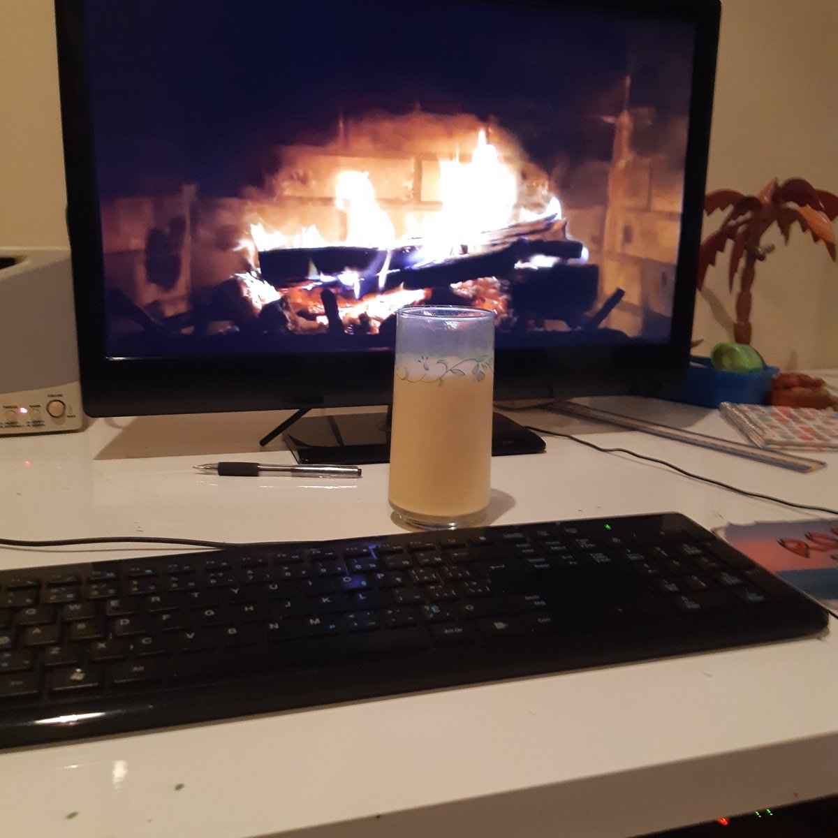 Sitting at my home desk enjoying my first rum and eggnog of the season while watching the fireplace channel. My daughter says I'm a nerd.