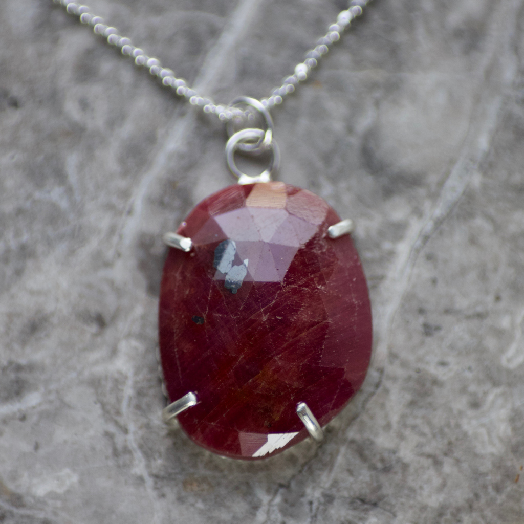 Another ruby today, this time with silver for all those non-gold wearers out there. 

Larger than the ruby and gold pendant &amp; also claw set, rather than bezel set, this one has lots of character &amp; an open back, beaded silver frame. 

#ruby #silver #necklace #handmade #jewellery