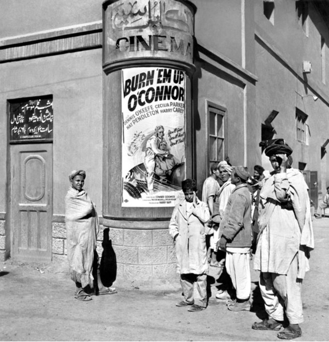 People of Kabul: Some youngsters looking at a Hollywood movie poster at the Kabul Cinema.Picture taken in 1946 (not sure if this date is correct).