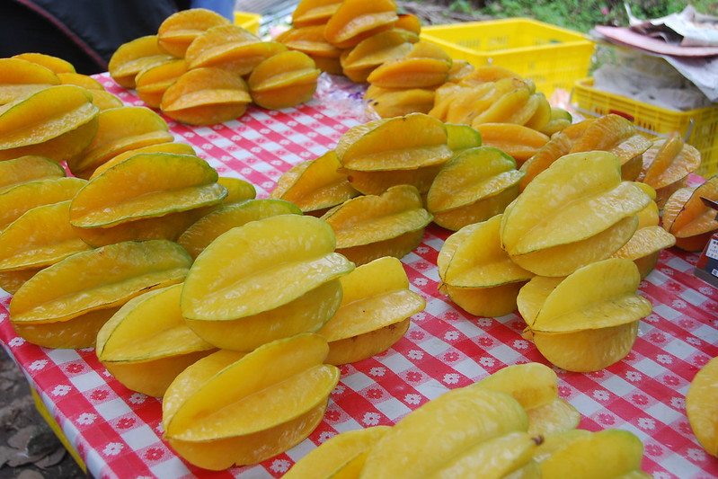 Caramboxin is found in starfruit, the fruit that is, uh, shaped like stars. It grows throughout Southeast Asia and tastes like a citrusy apple to me. It's a unique flavor and I rather like it. [pic by Ting W. Chang (CC BY-2.0)]