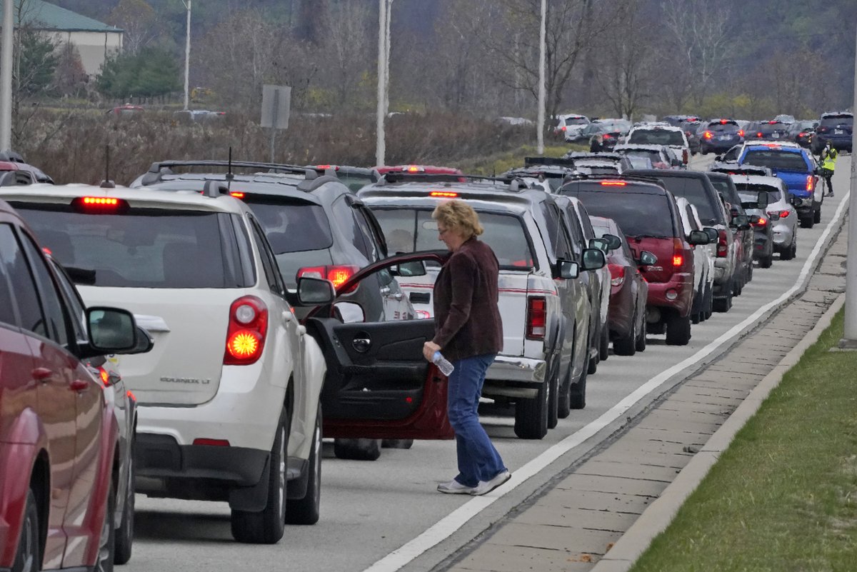 Cars wait in line during a Greater Pittsburgh Community Food bank drive-up food distribution in Duquesne, Penn. on Monday. Gene J. Puskar / AP