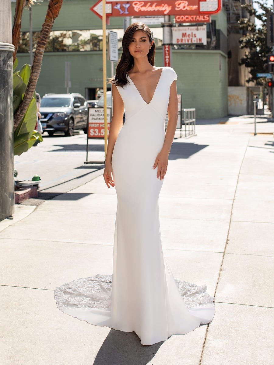 BuyBridal's tweet photo. PETERS by @pronovias arriving soon!! 
This wedding gown with unexpected lace inserts on the back has been designed for full impact as you walk down the aisle. With flattering cap sleeves, plunge V neckline and floor-sweeping royal train. #wedding #weddinginspiration https://t.co/guI3iHQPWv