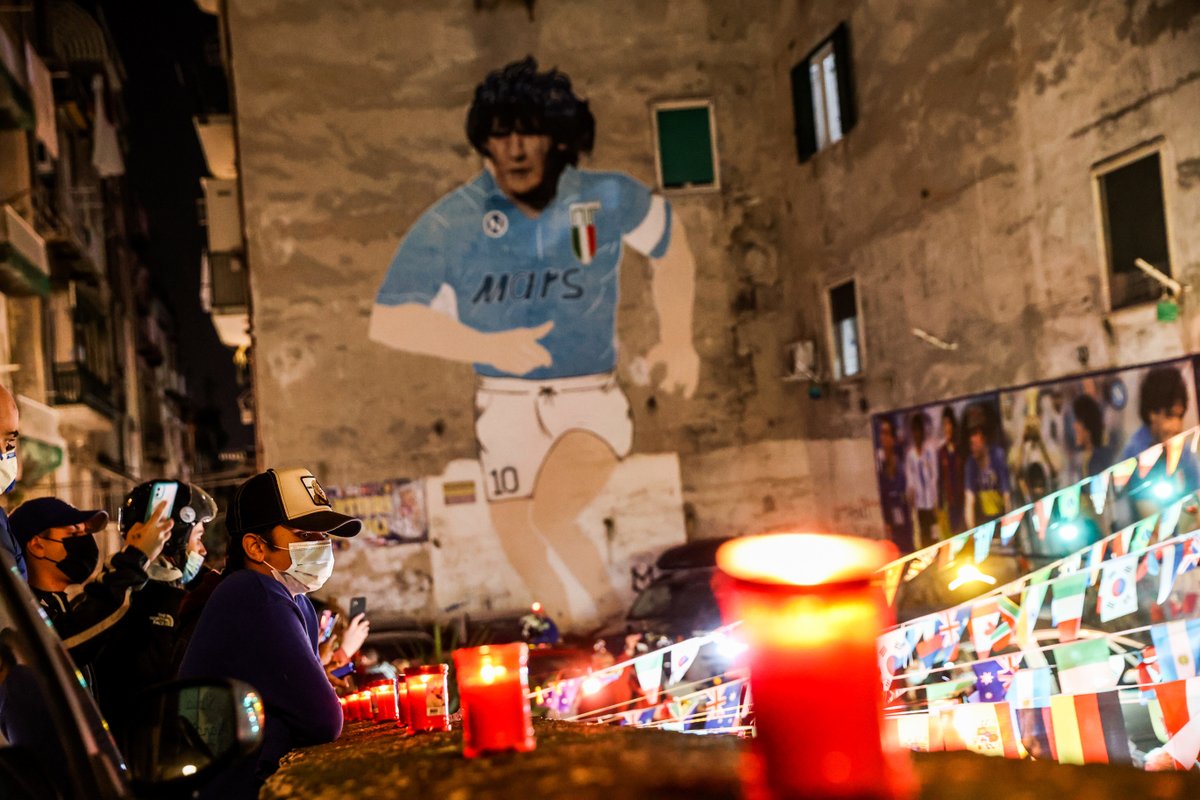 Squawka_Live's tweet photo. Napoli fans flocked to Diego Maradona's mural in Naples to remember their club's most iconic player. 💙 https://t.co/o8iQ8knNrB