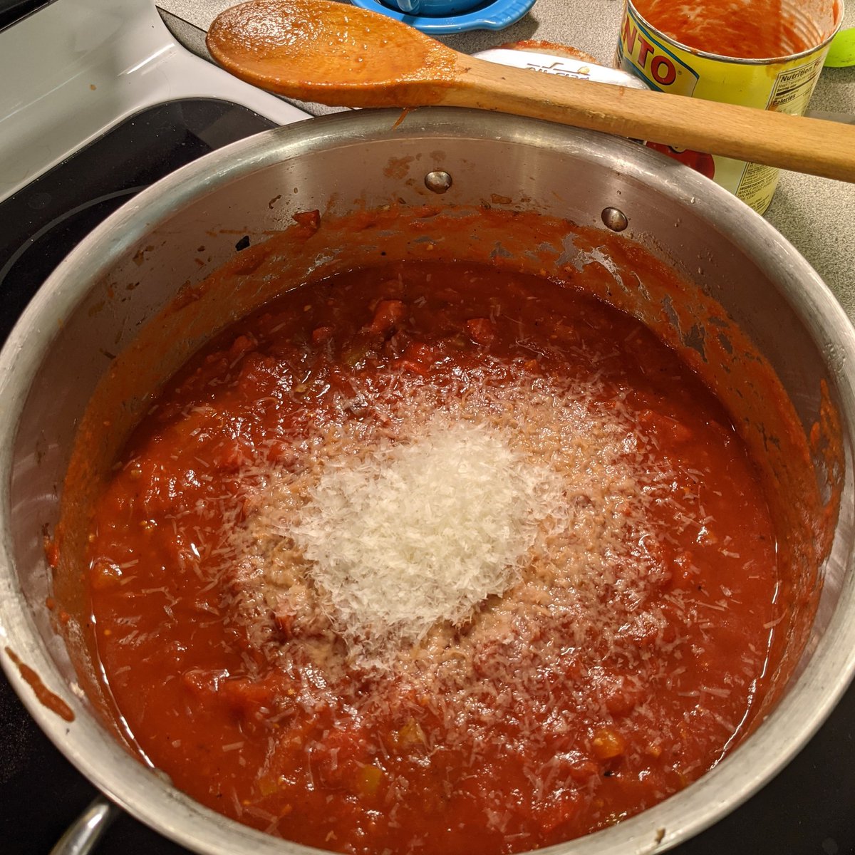 Four 15oz cans of tomatoes - two of them San Marzano. (In better years, I would start from fresh.) And I found a small cube of parm in the fridge that had to go. 5/8