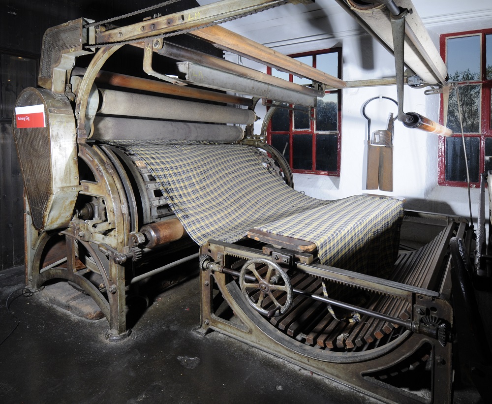This process was very labour intensive, and it took the 1800s to say ‘excuse us but this could be quicker actually’. Rows of teazles were mounted in frames around a rotating drum called a gig, which the cloth was pulled over. This Raising Gig is at Leeds Industrial Museum!