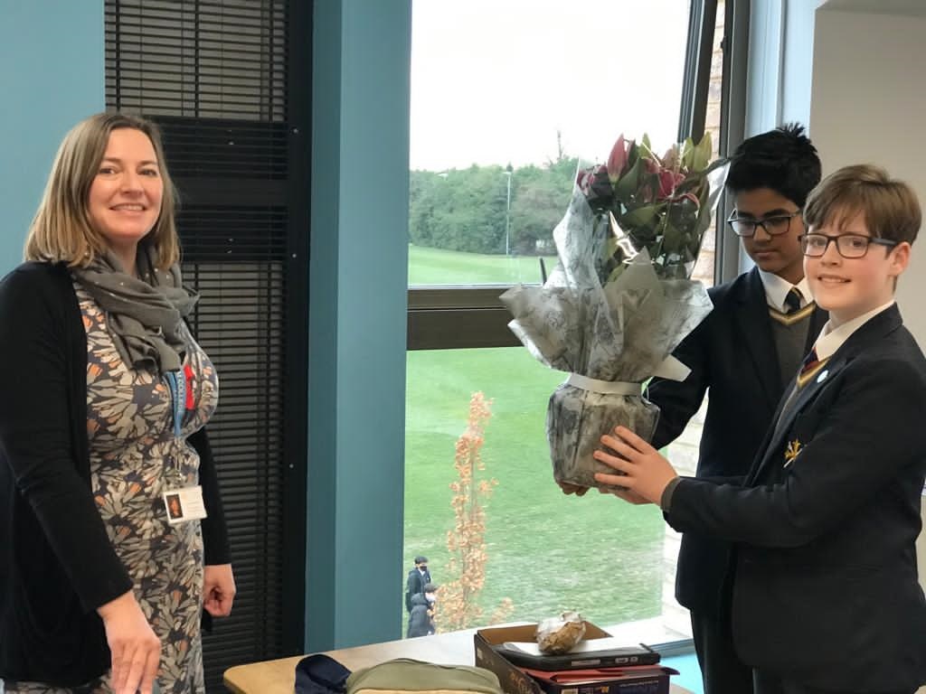 ElthamCollegeUK's tweet photo. We had to share this one! Joshi and Daniel (Year 8) present Mrs Bilsby, Head of Wellbeing with flowers to say "Thank You" for her support and her time in helping set up the Year 8 Change Makers Club! #ElthamFamily https://t.co/2rzk8PxyCB