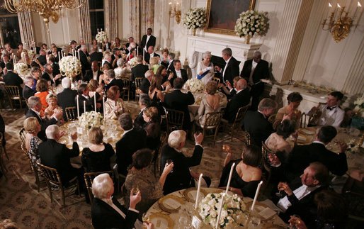 "Ceremonially, Chief Justice John G. Roberts, Jr. is sitting at the Queen’s right hand at dinner (and behind her at the concert). The Queen is the Patron of the 1,100-member Pilgrims Society of Great Britain and the United States (founded by Cecil Rhodes NWO Robber Baron)."