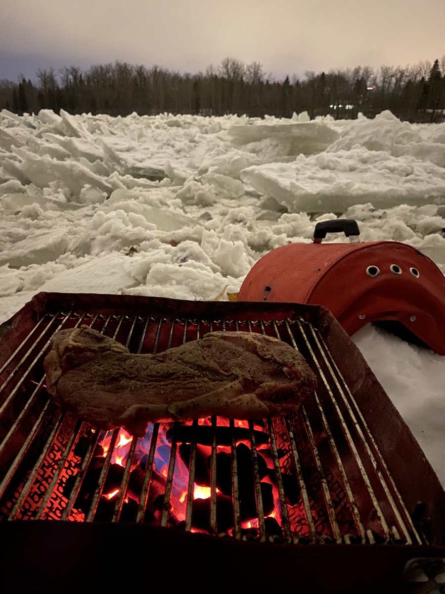 It’s Thursday night, I’m home late and everyone has eaten. On a whim I packed a lawn chair, a beer and rode out to the middle of nowhere and am sitting on an ice flow listening to coyotes and barbecuing a ribeye.  It’s actually kind of awesome, and exactly what I needed.