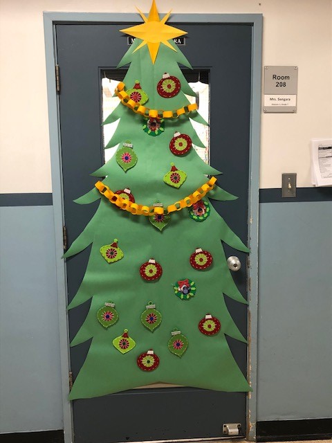Sd36Prince's tweet photo. Holiday Spirit in full swing at Prince Charles! Classroom doors getting the VIP Holiday treatment! 🎅🎄 #sd36learn @Surrey_Schools https://t.co/EC0PAuRwRs