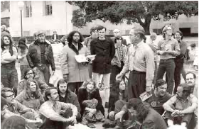 Here's my dad—standing on the right, looking out of the picture—listening to Holy Hubert with some other early Jesus people and assorted hippies.