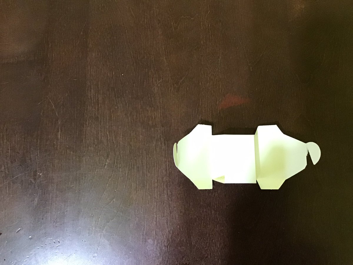 My advent tea calendar contains these little cardboard boxes. 
Interesting surface area question. The net includes semi-circles, trapezoids, rectangles and a square.