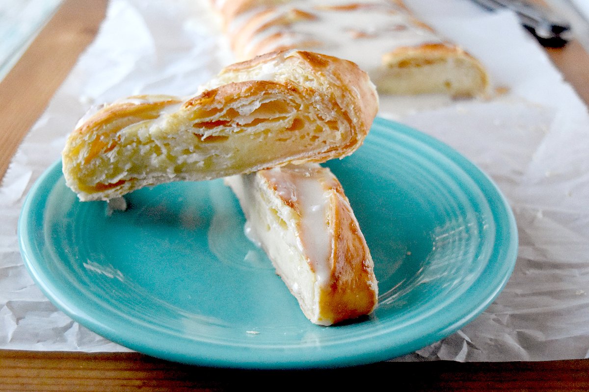 Eggnog Cream Cheese Danish comes together in no time and feeds the hungry masses until the presents are opened.  With a hint of eggnog in the filling and eggnog glaze on top, it’s the holidays wrapped in puff pastry.  #ChristmasSweetsWeek 
Recipe --> bit.ly/36VK8Za