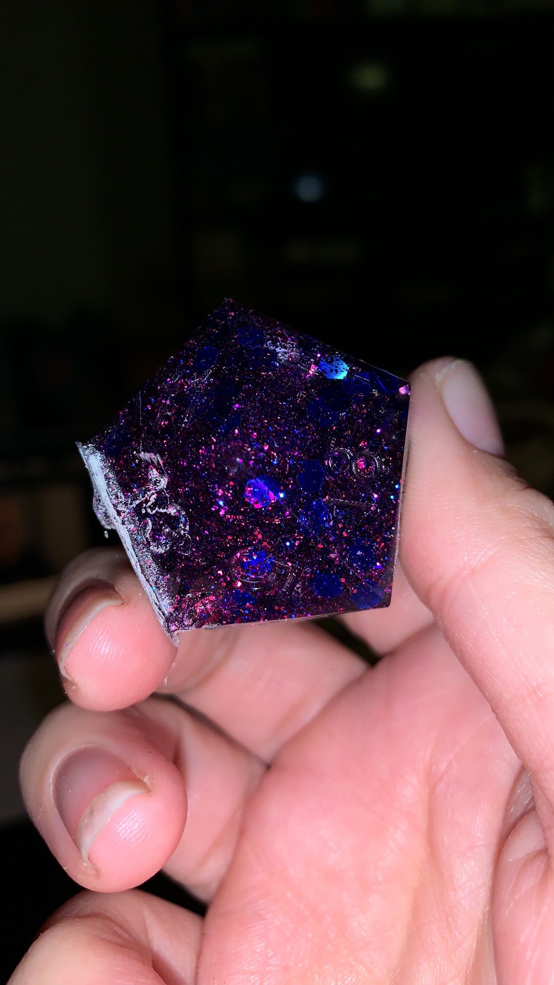4 pic. A d20 I made with uv resin and glitter. It’s for my roommate for Christmas. Just gotta paint the numbers and smooth out a couple spots and it’ll be done. https://t.co/GMlIxPkGeO