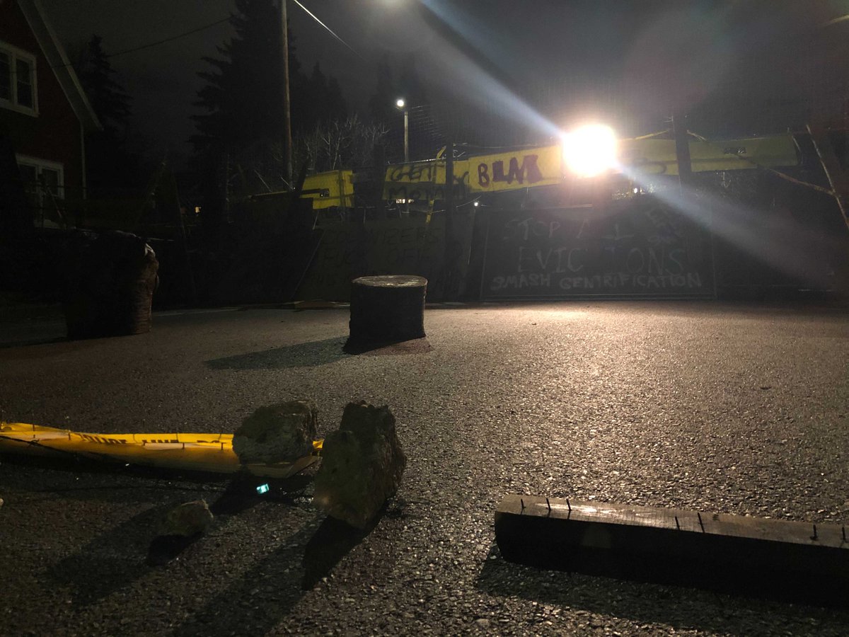Hundreds of people came to the Red House yesterday, some working together to construct these barricades blocking traffic on North Mississippi Avenue. The house is located in Albina, a historically Black residential neighborhood that has been gentrified.