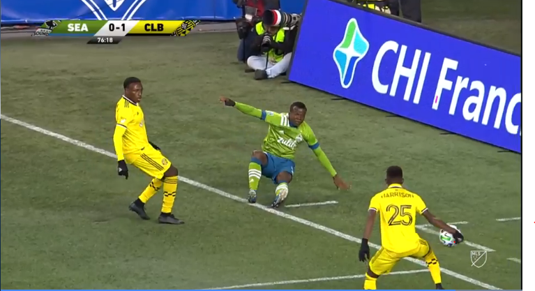 This is the point of contact with the hand/arm. Note that the arm is extended away from the body and arguably in a position that makes the defender unnaturally bigger by creating a barrier for the ball.  #Crew96  