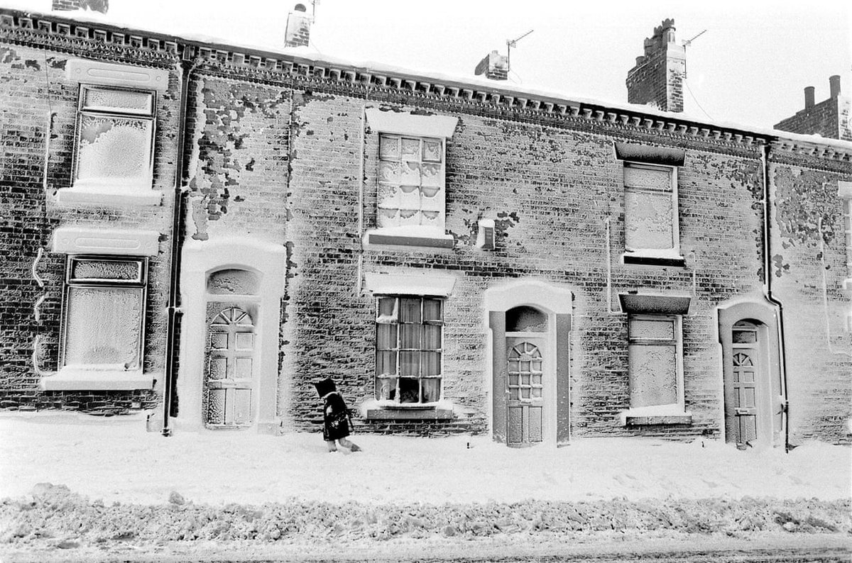 Day 10.The Ghosts of Christmas past  #AdventCalendar.A small child making her way home after school in Watersheddings, near Oldham, 1982.Photo Don McPhee