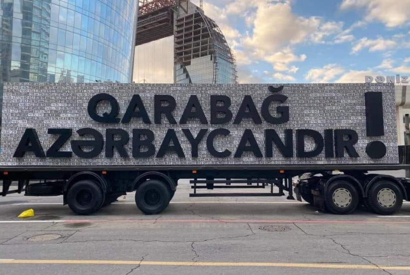 2) The 'Karabakh is Azerbaijan' truck was a direct response to the Armenian installation, a public toilet, whose outside wall was decorated with (Soviet) Azerbaijani license plates taken in Karabakh in early 1990s.