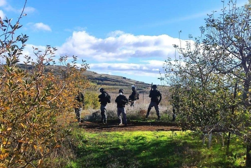 Israeli police in an orchard on Syrian agricultural land in the occupied Syrian Golan yesterday when dozens of Syrians were injured by rubber bullets and tear gas. The Syrians were peacefully protesting against the construction of a massive windfarm on their remaining farm land.