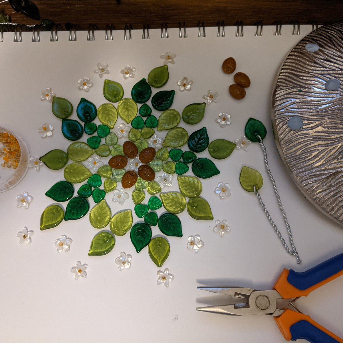 Happy Hannukah! When it's not on fire I'm going to be spending the next few days trying to turn my Menorah into an almond tree of life with these little glass leaf beads, Czech glass almond nuts, and shell blossom flowers   #Hannukah  #Hannukah2020