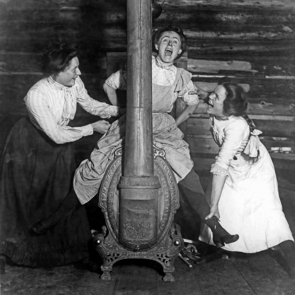 1902: Woman on a stove _ Photographer Mattie Gunterman at the Nettie L cookhouse near Ferguson, British Columbia with sisters Annie and Rose Williams _ For more pictures like this, follow @Retronaut
