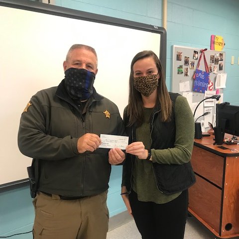 Each Christmas, KYASRO receives nominations to support programs throughout the state, and we are proud to support Grant County Middle School's "Christmas Giving" program! Pictured are Grant County SRO Robert Morgan and teacher/chair of Christmas Giving, Kelli Hollencamp.
