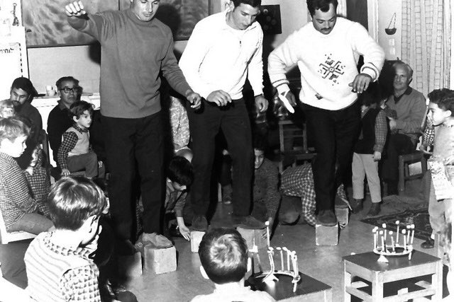 Parents play Hanukkah games at a kindergarten party, Israel in the 50’s.
